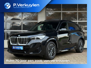 Hoofdafbeelding BMW X1 BMW X1 xDrive23i M SPORT | PANORAMADAK | TREKHAAK | HARMAN KARDON | DRIVING PROFF. | MEMORY SEATS |
