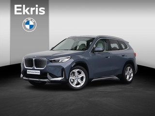 Hoofdafbeelding BMW iX1 BMW iX1 eDrive20 67 kWh Nieuw/ X-Line/ Verwarmd Stuurwiel/ Sportstoelen/ Harman-Kardon/ Elektrische Trekhaak/ Achteruitrijcamera/ Stoelverwarming
